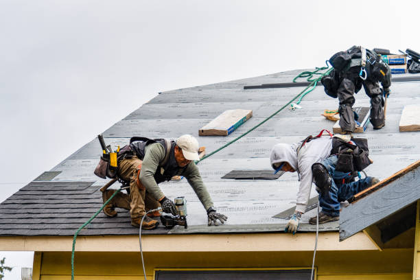 Professional Roof Replacement technician working in Mentone, IN